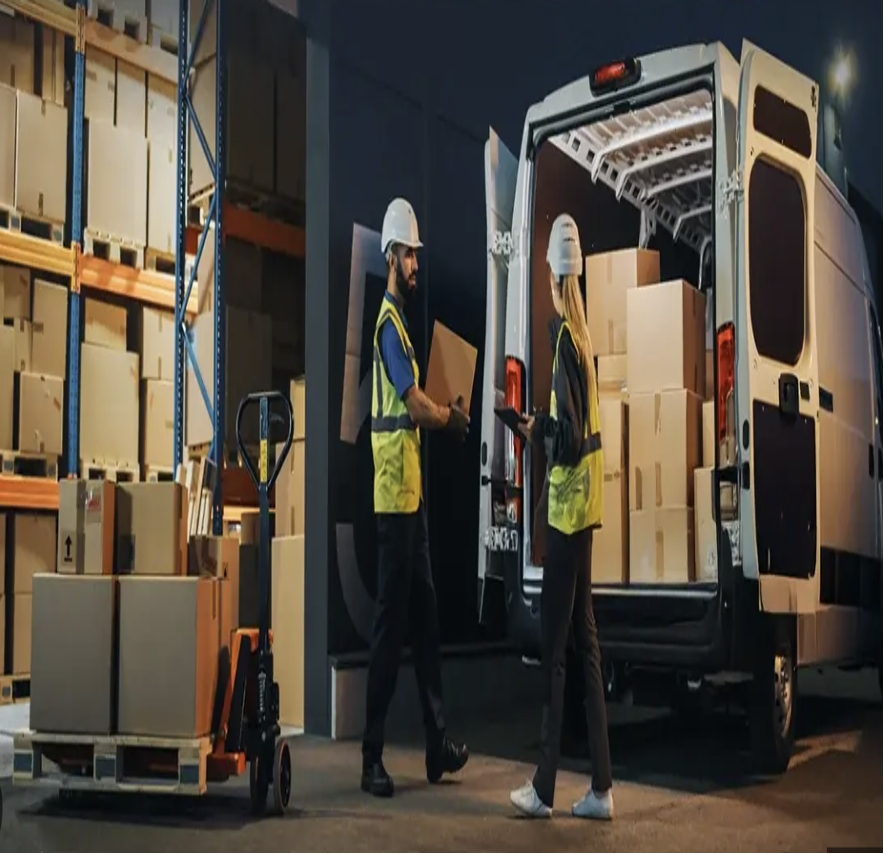 Warehouse workers loading delivery truck