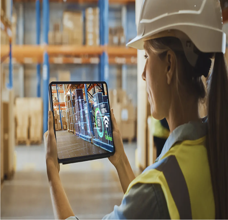 Woman with tablet showing warehouse data visualization